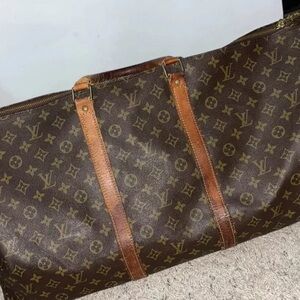 Size 60 Louis Vuitton duffle bag with strap